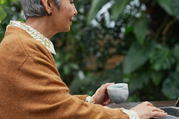 An older woman using a computer