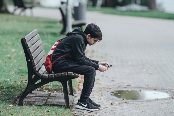 Teenager using mobile phone