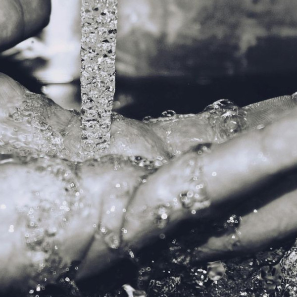 Hand under running water